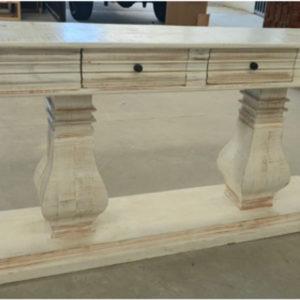 Santa Lucia Console Table with whitewashed finish, two storage drawers, and chunky farmhouse pedestal legs