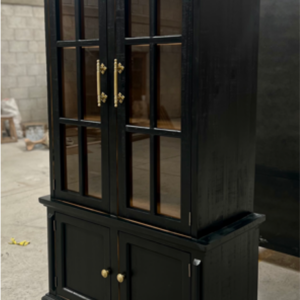 Heritage Black Display Cabinet with tall glass doors, antique gold hardware, and lower cabinet storage